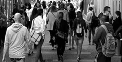 busy street sidewalk filled with people.