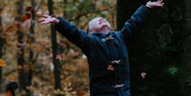 Child throwing leaves