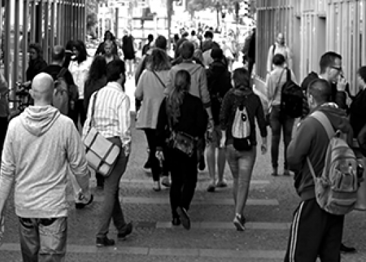 busy street sidewalk filled with people.