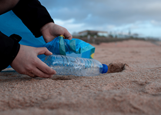 plastic water bottle on a sandy beach