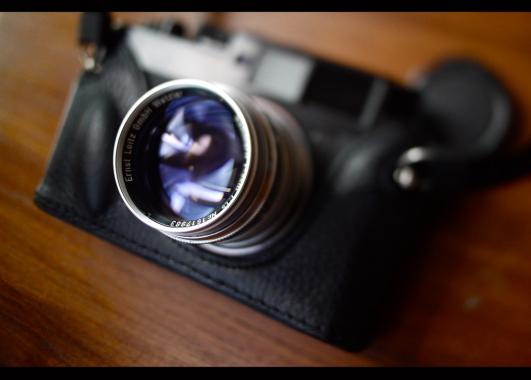 Photo of a camera focused on the lens.