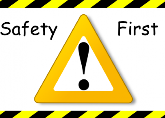 Yellow and black caution tape in a square around a yellow triangle with a black exclamation mark. 