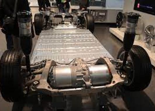 Picture of the base frame of a car with an electric engine in the front.